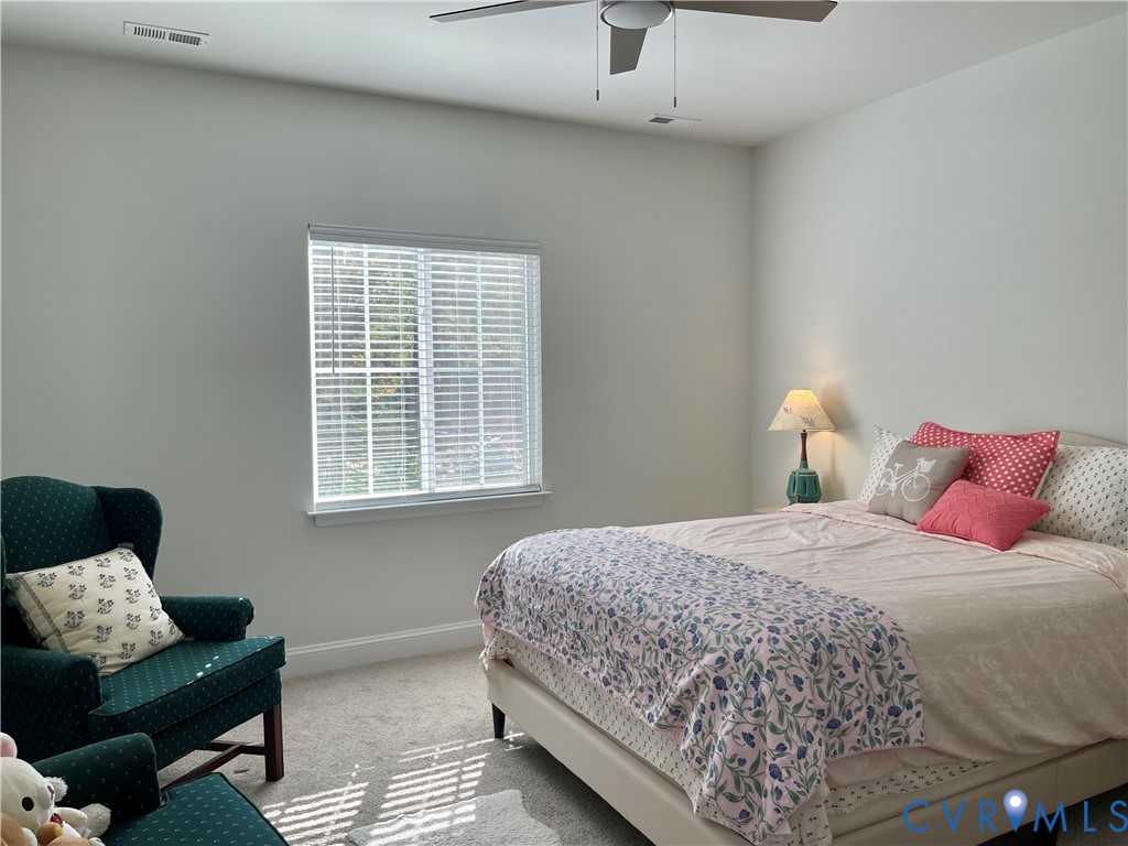 Recessed lighting, ceiling fan, window with blinds, and carpeted flooring