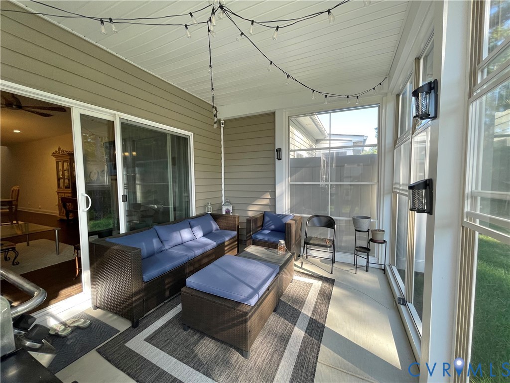 Screened porch with vinyl siding and a white paneled ceiling