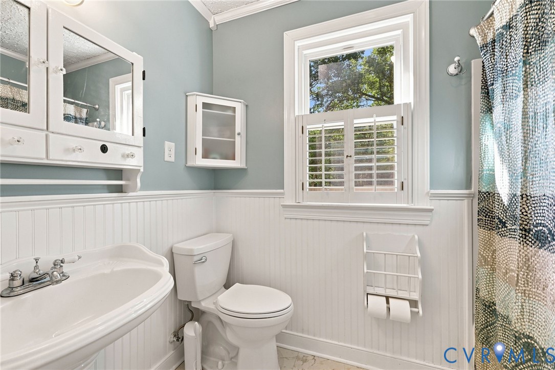 New shower/tub, wainscoting, privacy shutters