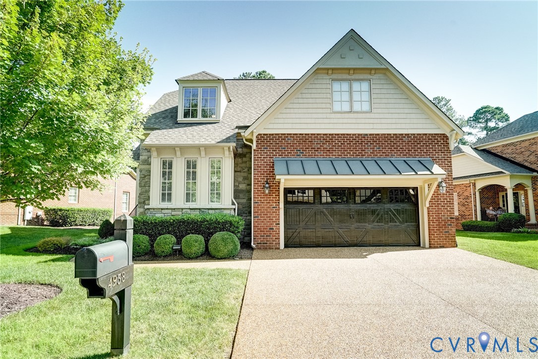 Brick and stone exterior with decorative shingle accents