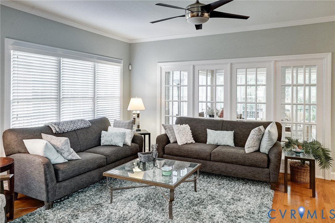 Crown molding and recessed lighting complement the ceiling fan