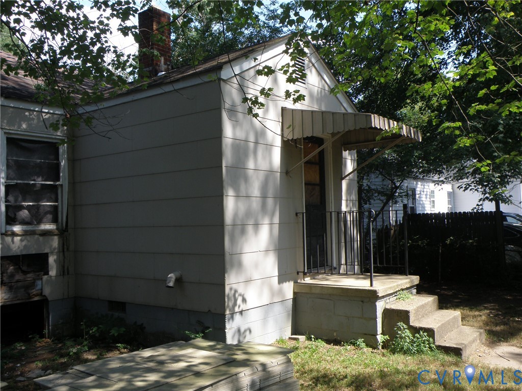 Back stoop and stairs to utility room and kitchen Back stoop and stairs to utility room and kitchen