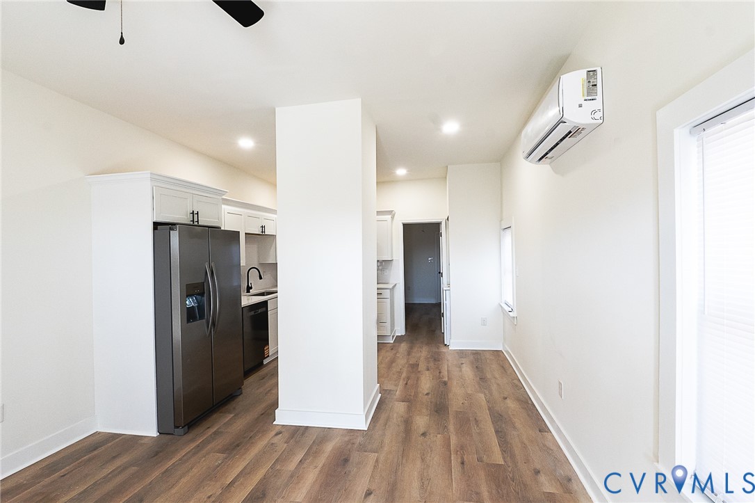 LVP flooring, recessed lighting, and a ductless mini-split system