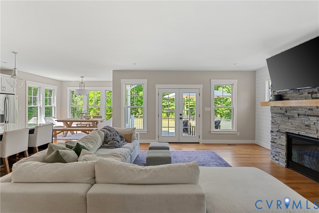 Open-concept living area with hardwood flooring