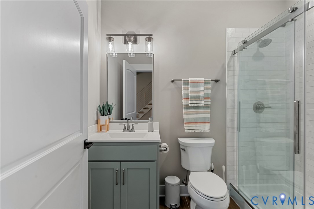 Vanity with white countertop, chrome faucet, and integrated sink