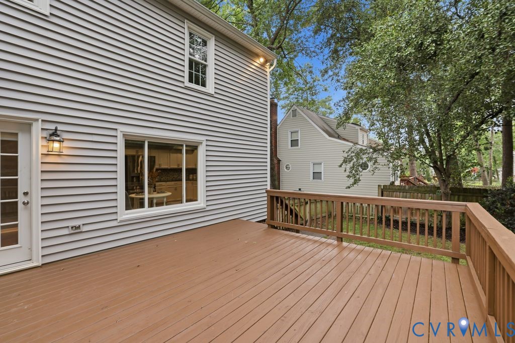 Expansive wood deck with a perimeter railing