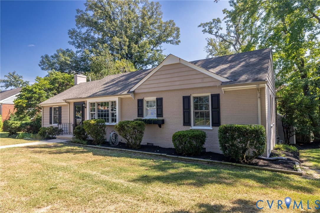 Traditional-style exterior with a gabled roof and brick facade