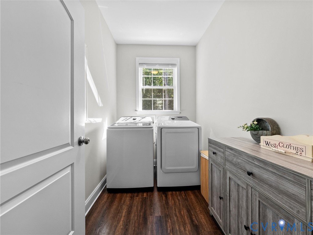 Wood-finish flooring, white walls, and a window providing natural light