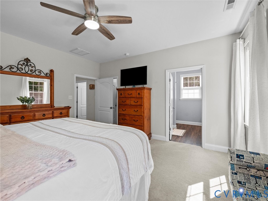 Recessed lighting, ceiling fan with light fixture, light gray wall paint, and white trim molding