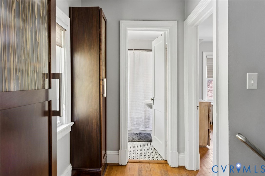 Wood-finish flooring with light gray wall paint
