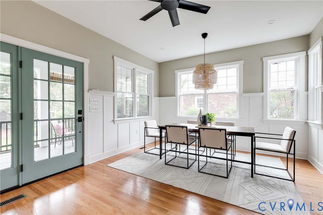 Hardwood flooring with a matte finish ceiling fan and recessed lighting