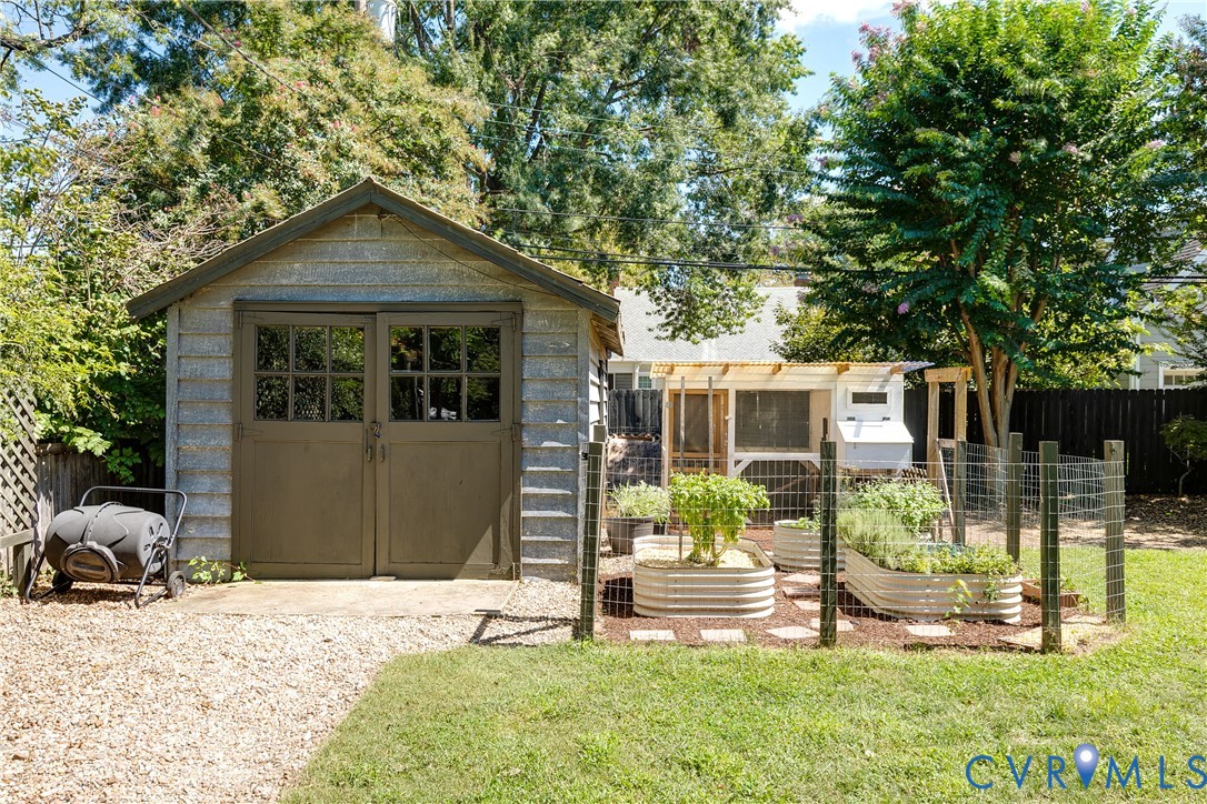 Storage shed with gambrel roof and double doors