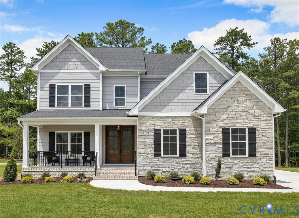 Two-story exterior featuring stone veneer, horizontal siding, and shake siding