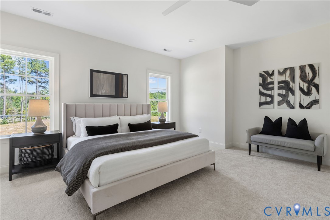Bright interior with light-toned walls and carpet flooring