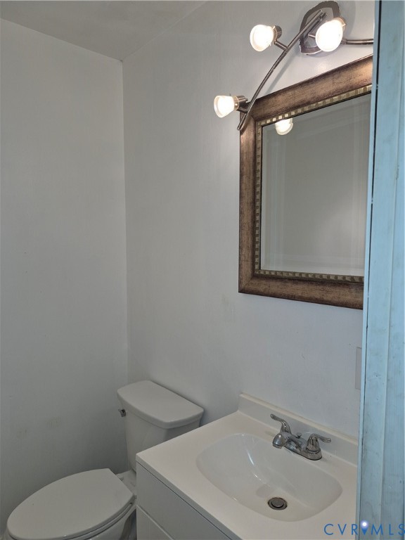 White vanity with an integrated sink and chrome faucet