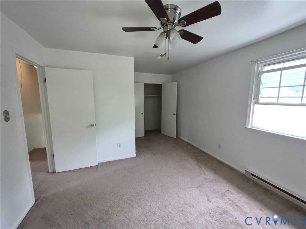 Neutral-toned carpeting with white walls