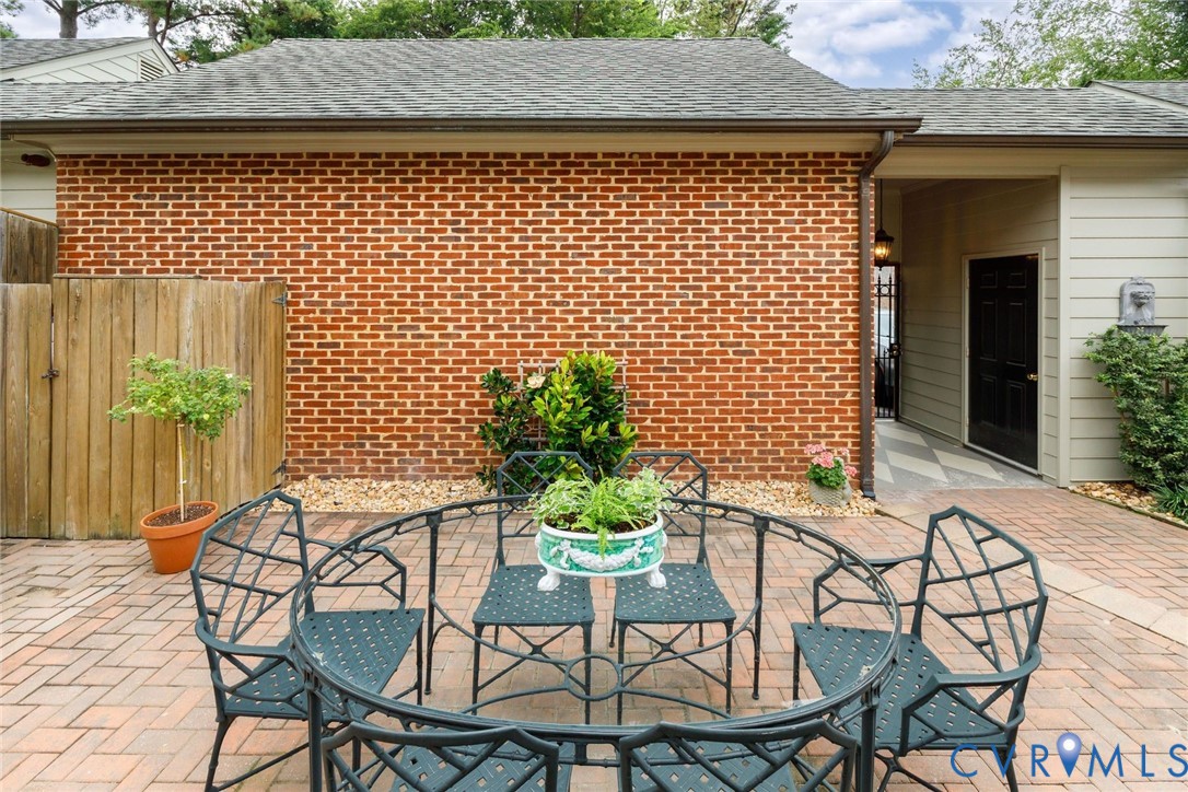 Brick garage with breezeway to garden house and gate to rear parking