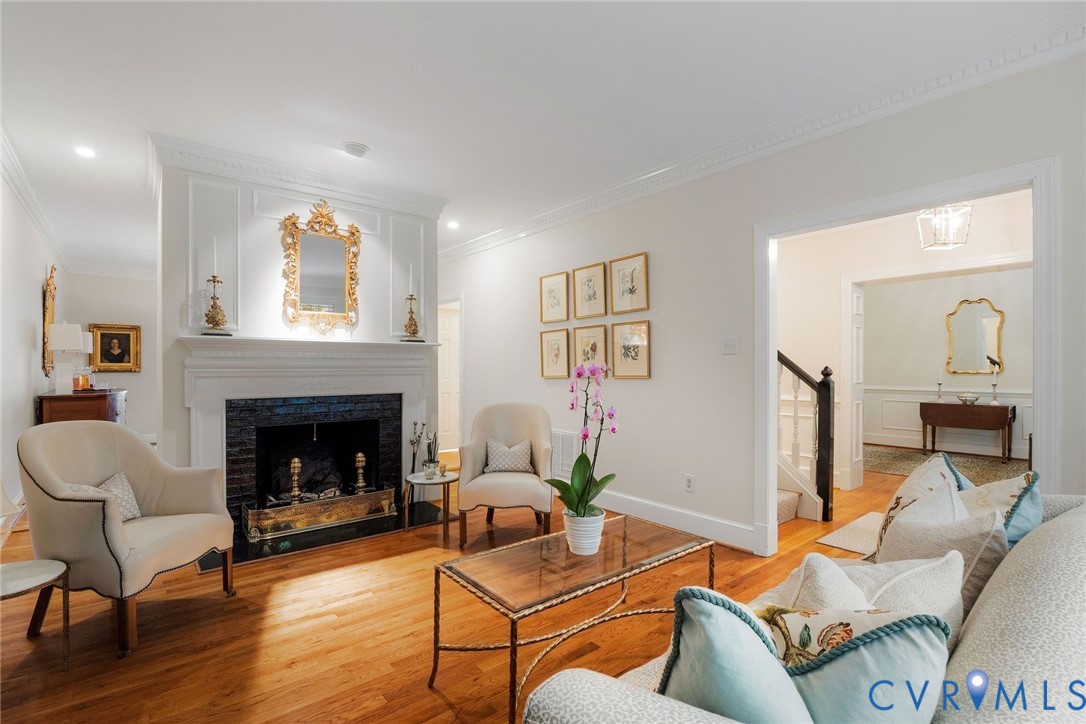 Elegant living room with gas fireplace and decorative mantel Elegant living room with gas fireplace and decorative mantel