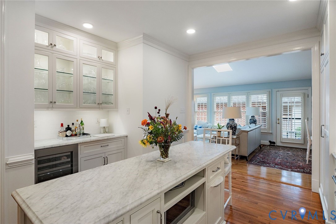 Lighted glass cabinets; wide opening to family room