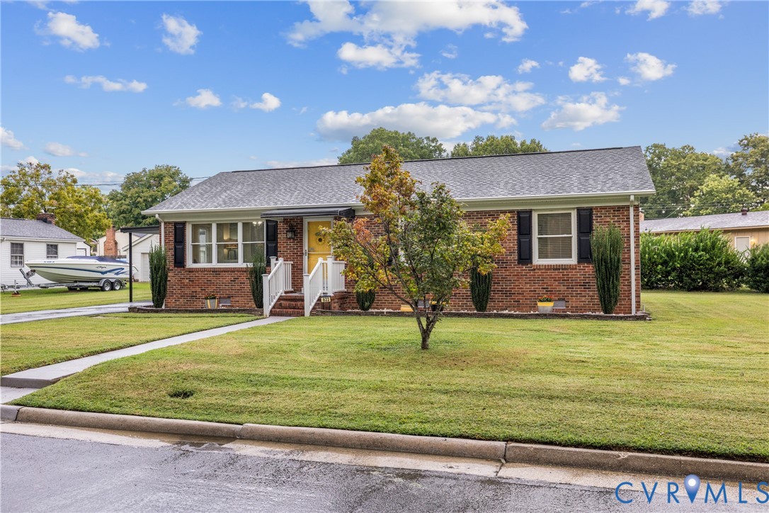 Brick exterior with a gray shingle roof