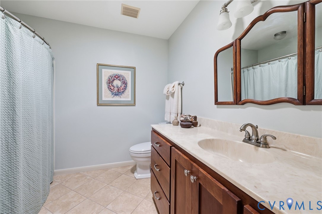 Hall bath with shower and tub.