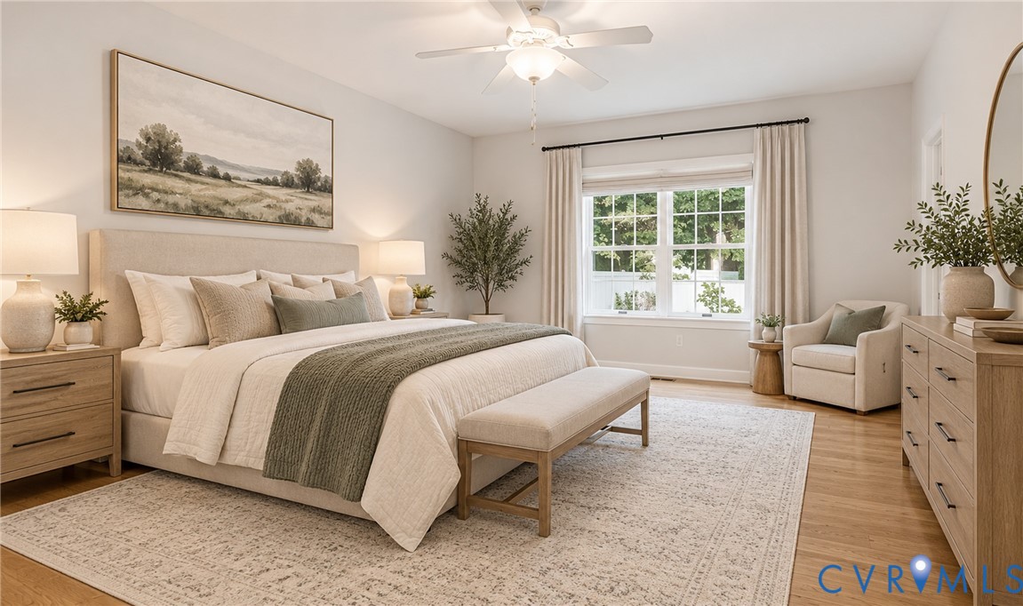 Light wood-finish flooring with a large area rug