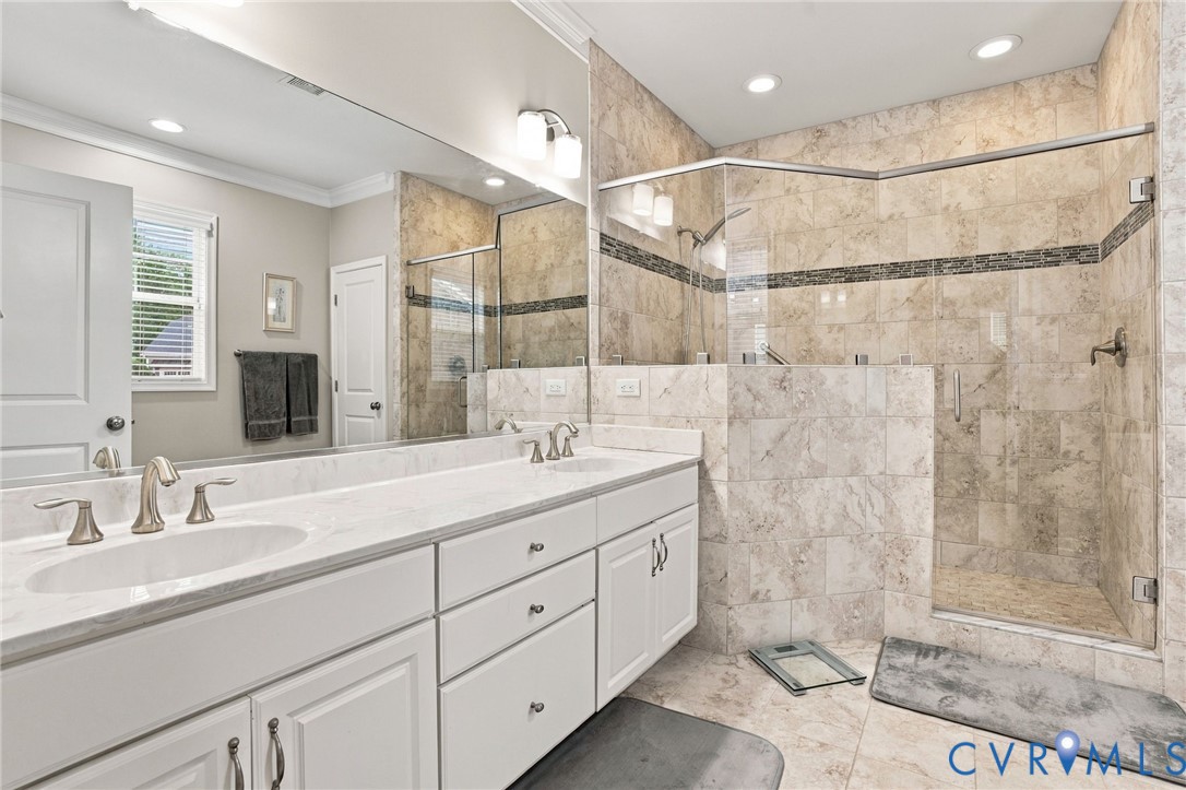Dual vanity with white cabinetry and brushed nickel hardware