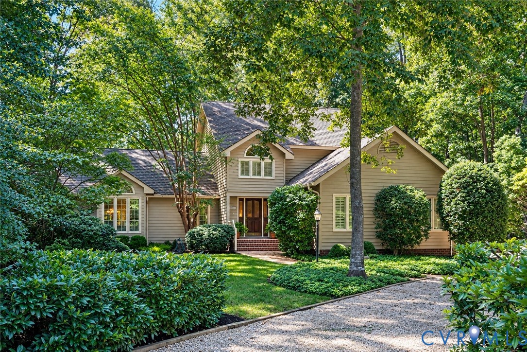 Thoughtfully designed and custom built by the original owners with local builder Mike Dumont, this distinctive home blends beautifully with its wooded James River West setting.