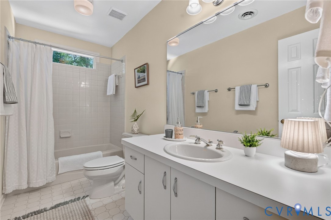Second floor full bath with transom window to let in more natural light!