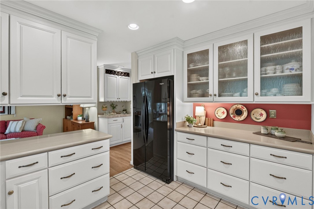 Glass-front cabinetry adds a nice touch of character and display space.