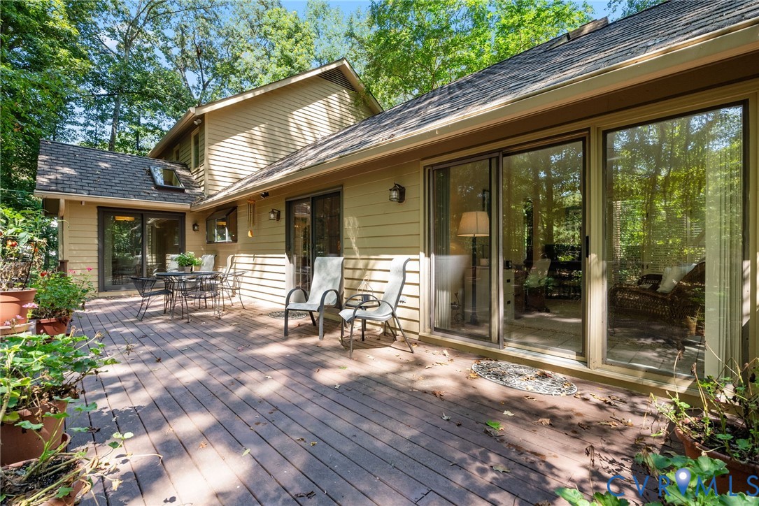 The spacious rear deck opens to the family room, dining area and sunroom, creating an easy flow for entertaining.