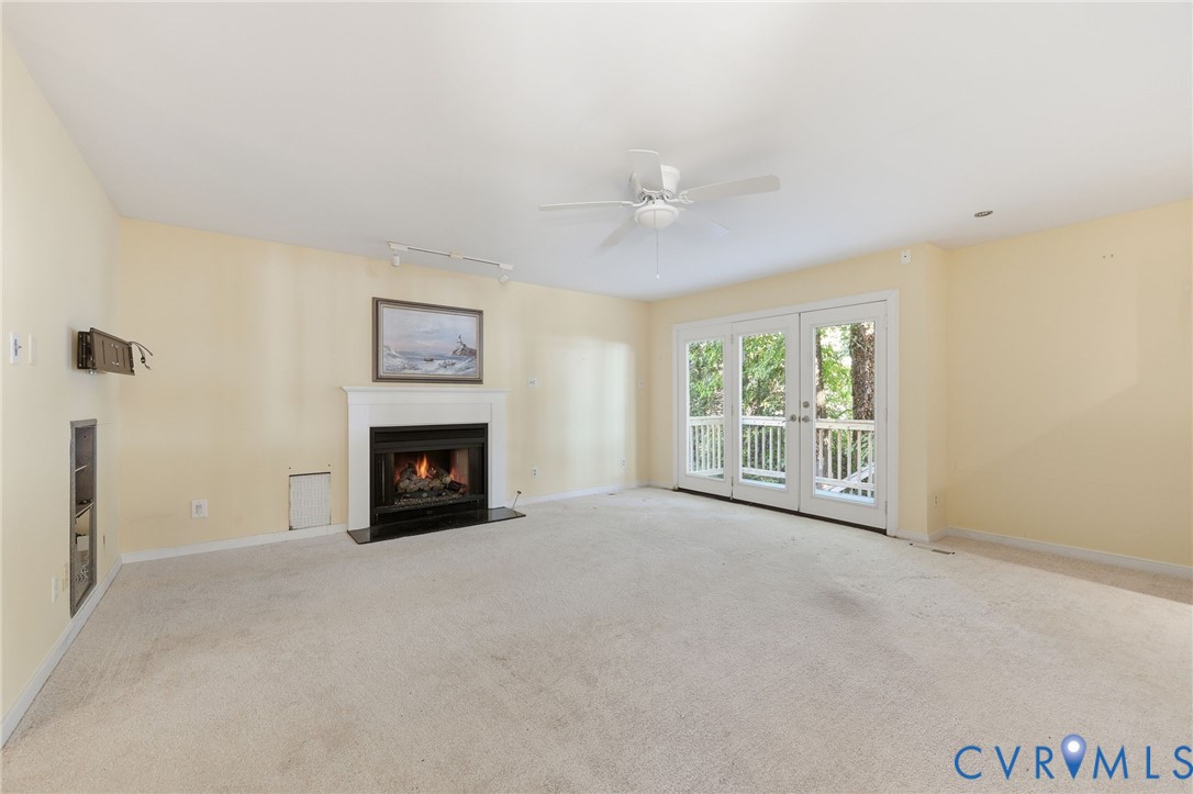 Gas fireplace, access to deck.  Built-in stereo cabinet and niche for woofer.