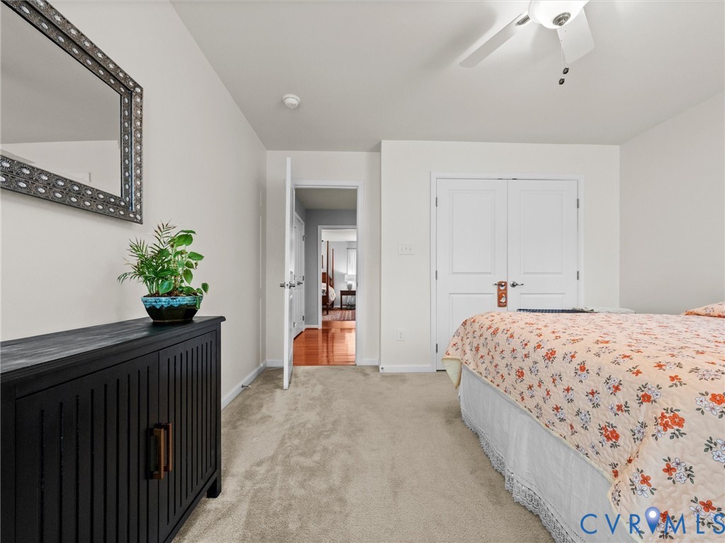 Neutral-toned wall paint with a white ceiling fan and light fixture