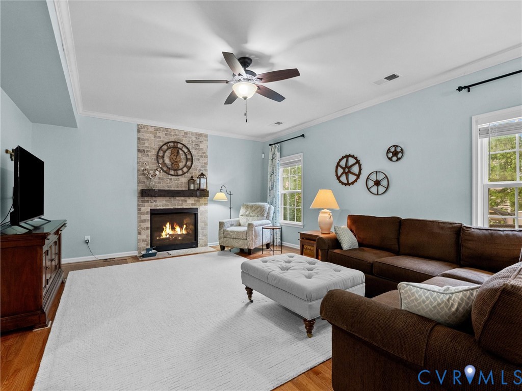 Brick-faced fireplace with a wood mantel