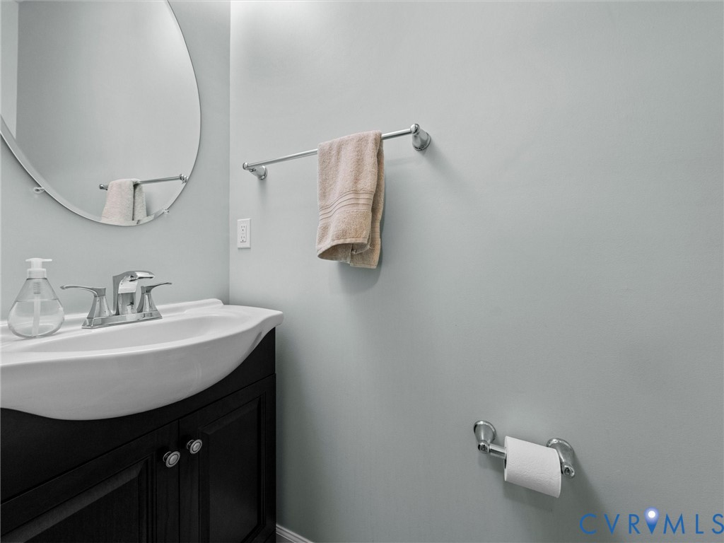 Wall-mounted vanity with a white basin and chrome faucet