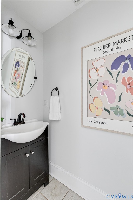 Powder room with a dark wood vanity, white basin sink, and matte black faucet