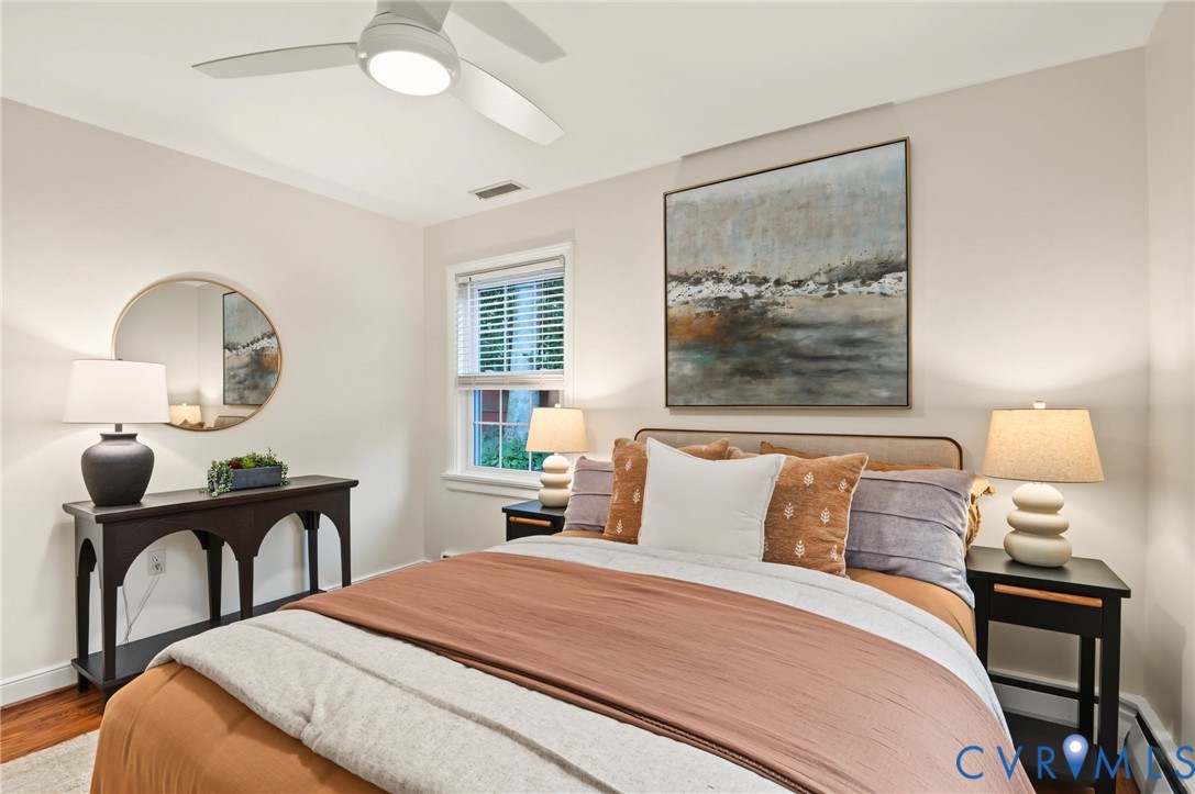 Hardwood flooring, recessed lighting, and a ceiling fan with integrated lighting