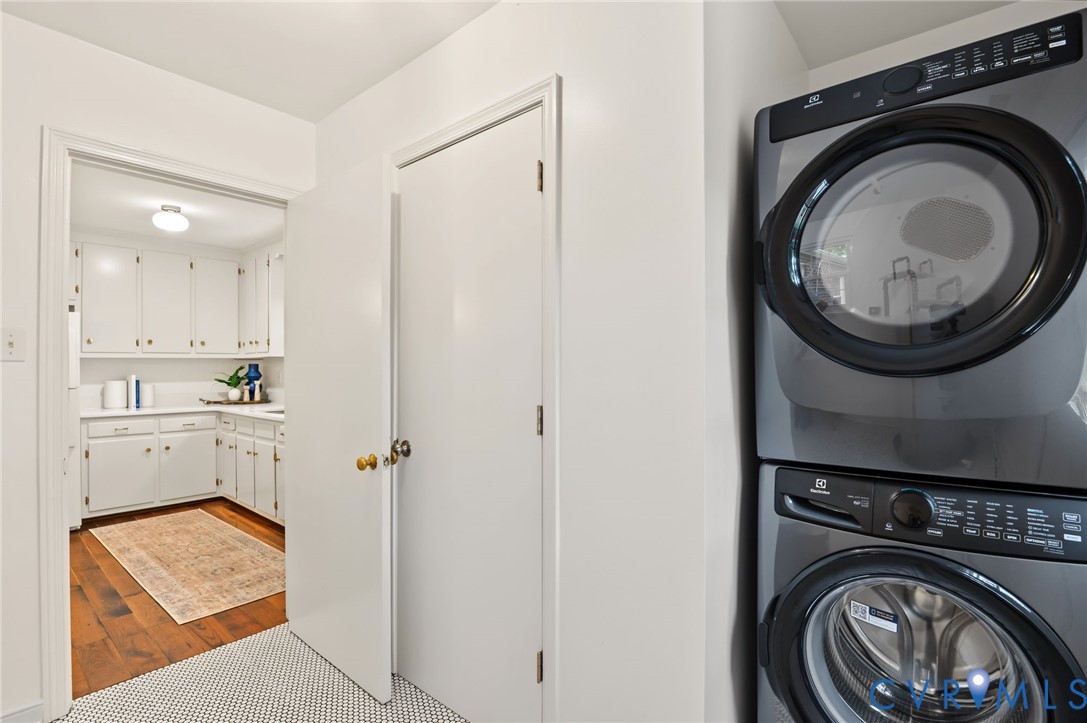 Stacked laundry appliances with a front-load washer and dryer