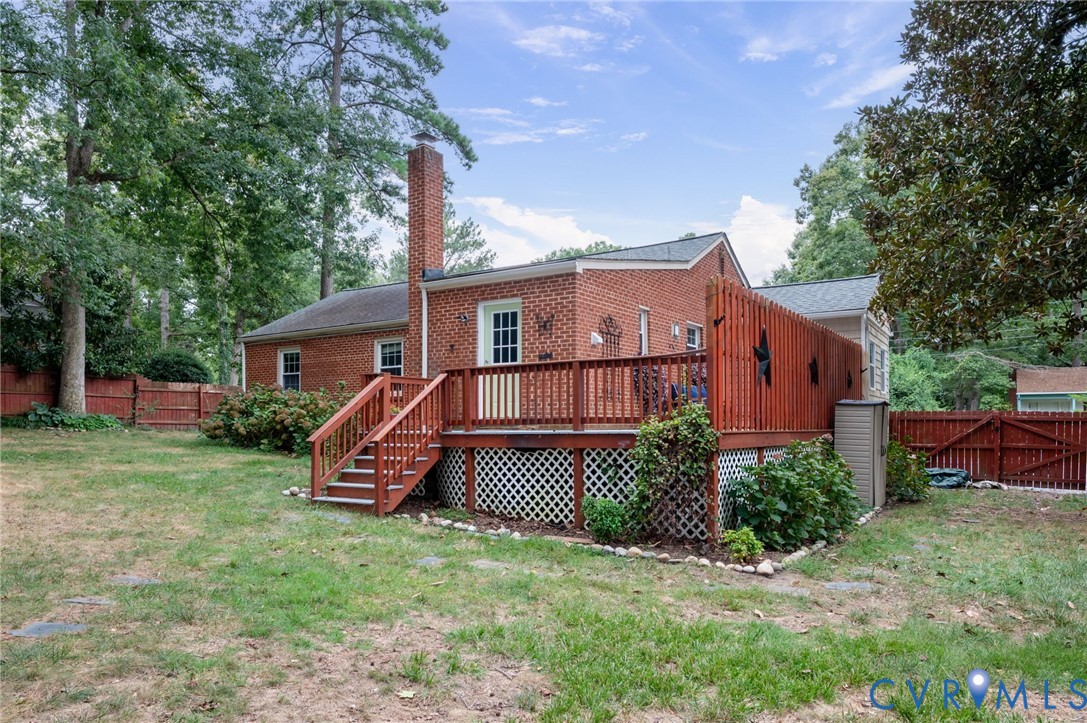 Brick exterior with an elevated wood deck