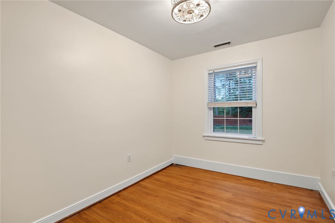 Hardwood flooring paired with light-toned walls