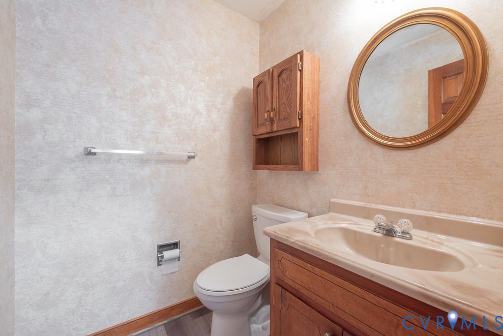 Wood-finish vanity with an integrated sink and countertop