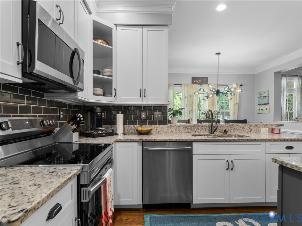 glass tile backsplash and under cabinet lighting