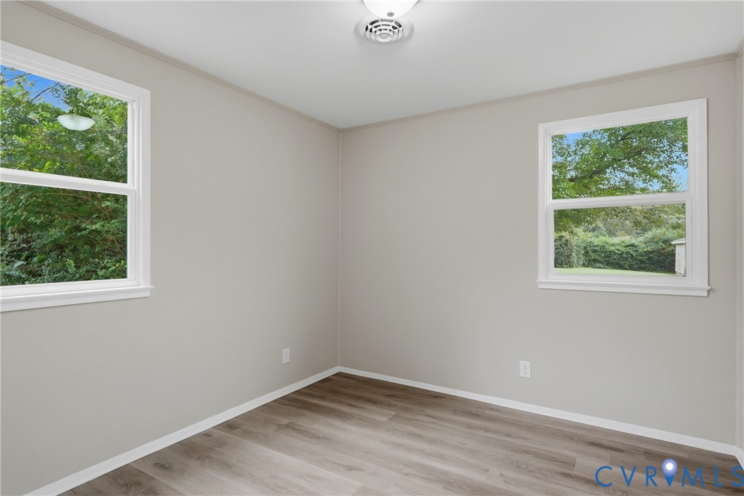 Neutral-toned walls complement wood-finish flooring