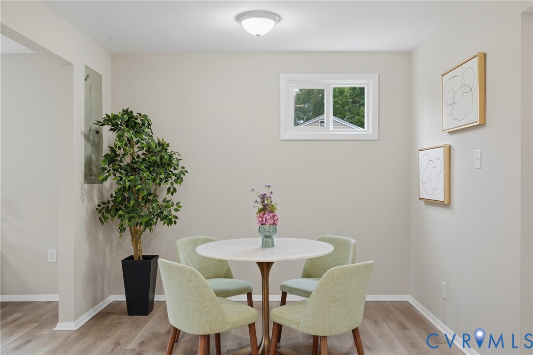 Wood-finish flooring throughout, complemented by a white trim