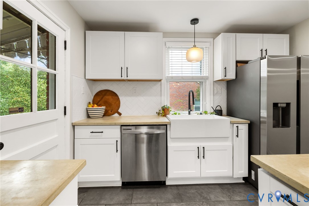Featuring new cabinets, concrete counters, stainless appliances, and subway tile backsplash... Featuring new cabinets, concrete counters, stainless appliances, and subway tile backsplash...