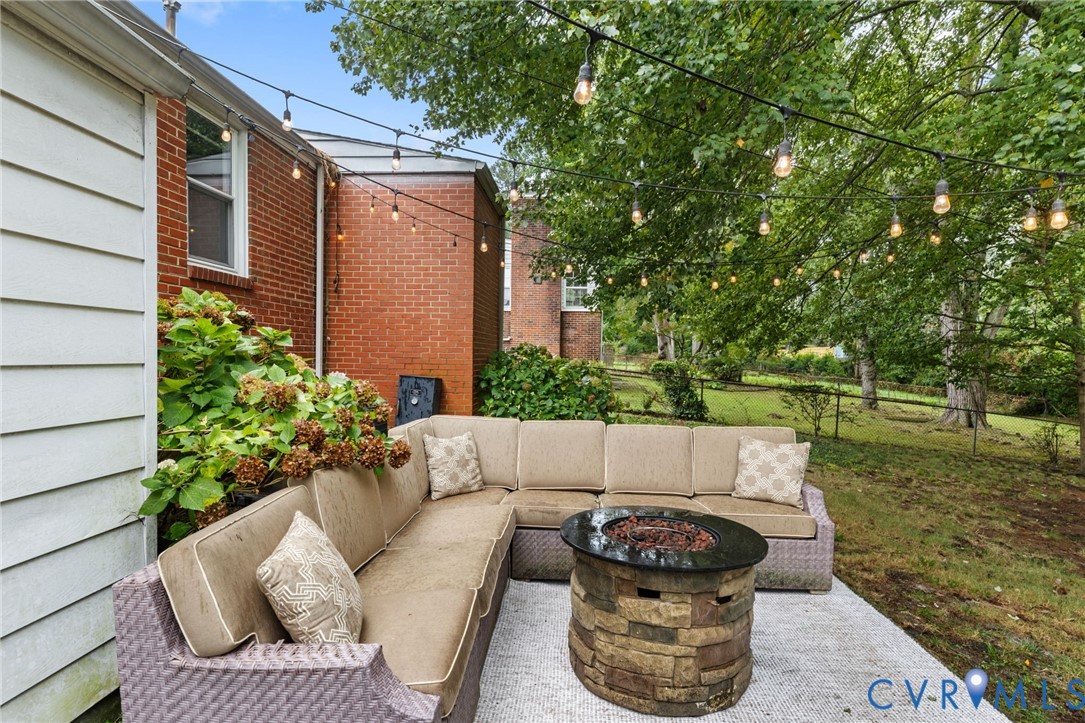 Spacious concrete patio area, perfect for a fire pit hangout