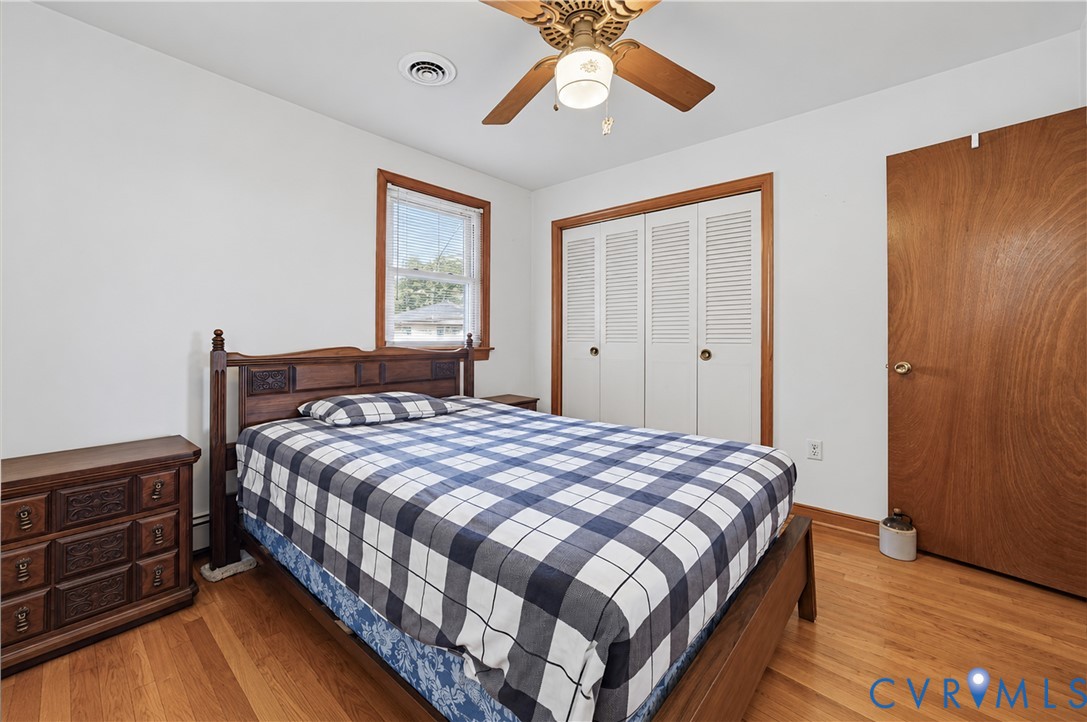 Hardwood flooring with white walls and wood trim