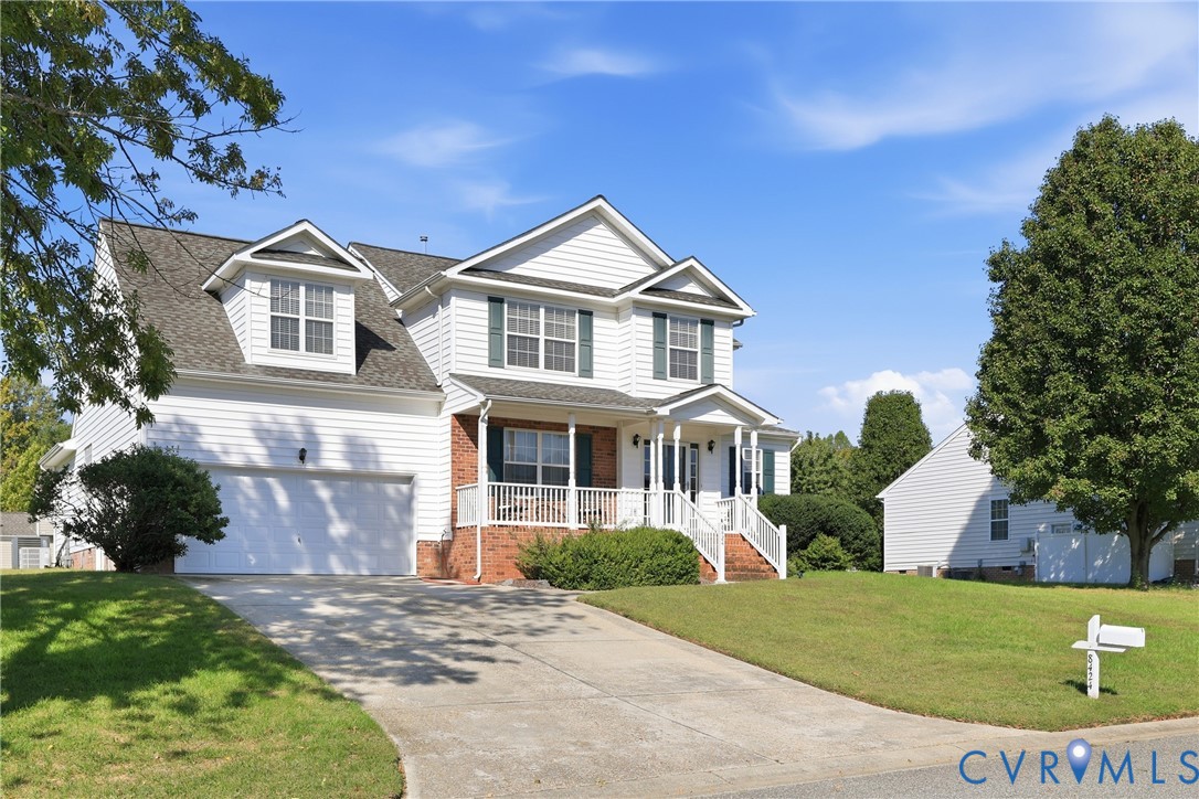 Beautiful 2-story Williamsburg home with attached 2-car garage, covered entry, and spacious front lawn Beautiful 2-story Williamsburg home with attached 2-car garage, covered entry, and spacious front lawn
