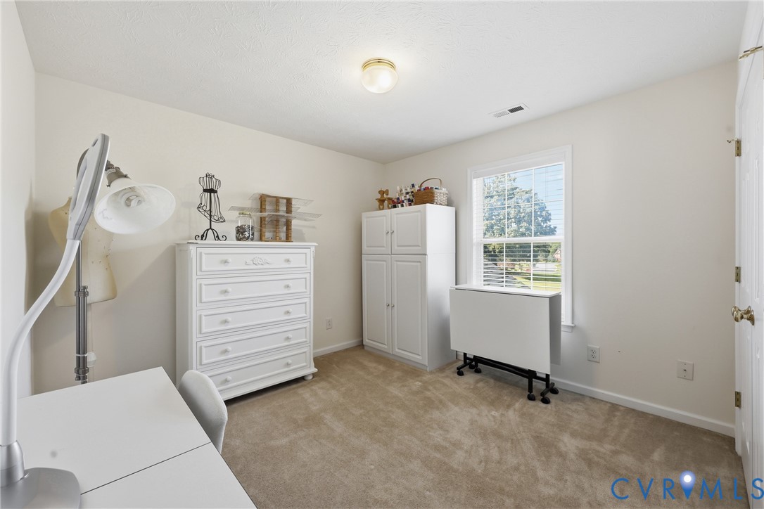 This versatile bedroom can serve as a guest room, child's bedroom, or private space for hobbies