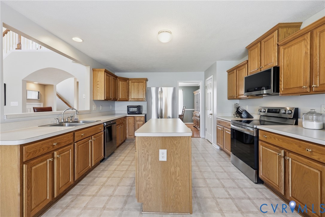 A spacious kitchen offers plenty of room to prepare meals, gather at the island, and enjoy casual dining A spacious kitchen offers plenty of room to prepare meals, gather at the island, and enjoy casual dining